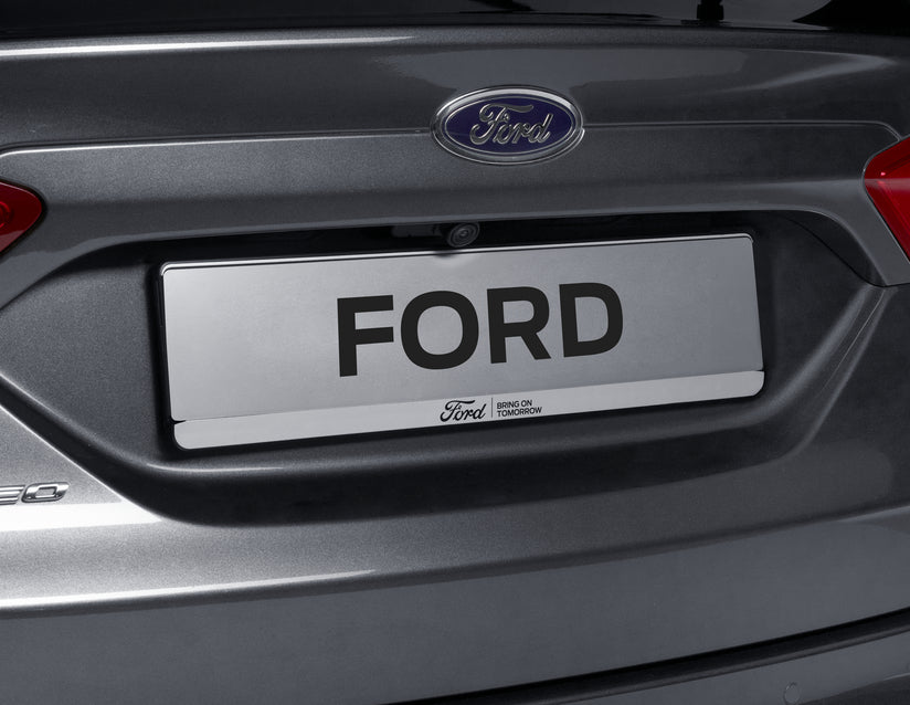 Genuine Ford Licence Plate Holder silver, with blue Ford logo and black "BRING ON TOMORROW" lettering