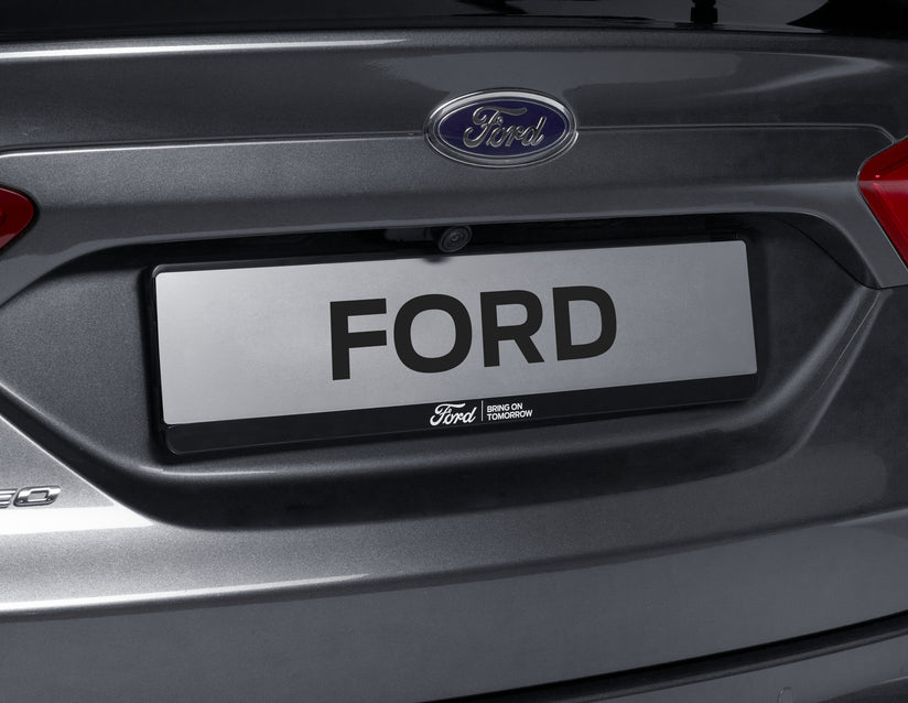 Genuine Ford Licence Plate Holder black, with blue Ford logo and white "BRING ON TOMORROW" lettering