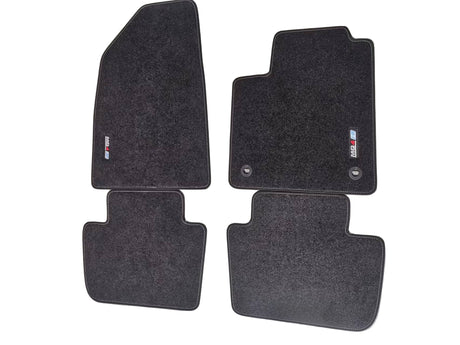A set of black fabric floor mats with an embroidered logo, designed for a MG4 EV vehicle.